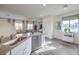 Bright open floor plan showcasing a large kitchen island and inviting living space at 7915 Pandora Sky St # 402, Las Vegas, NV 89084