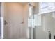 Modern tiled shower featuring glass doors and a sleek design at 7915 Pandora Sky St # 402, Las Vegas, NV 89084