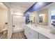 Bathroom featuring a glass-enclosed shower, spacious vanity, and modern finishes at 7915 Pandora Sky St # 403, North Las Vegas, NV 89084
