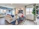 Cozy living room featuring comfortable seating, large windows, and stylish decor at 7915 Pandora Sky St # 403, North Las Vegas, NV 89084