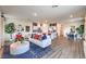 Sunlit open-concept living room with view of dining and kitchen area at 7915 Pandora Sky St # 403, North Las Vegas, NV 89084