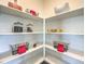 Well-organized pantry with bright white shelving and decor at 7915 Pandora Sky St # 403, North Las Vegas, NV 89084