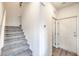 Well-lit stairway with carpeted steps and neutral wall color at 7915 Pandora Sky St # 403, North Las Vegas, NV 89084