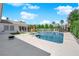 Lush backyard featuring a swimming pool, spa, lounge chairs, and a play set at 8000 Clock Tower Ct Ct, Las Vegas, NV 89117