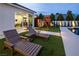 Cozy backyard featuring lounge chairs, playset, and an exercise room with a pool, ideal for relaxation and entertainment at 8000 Clock Tower Ct Ct, Las Vegas, NV 89117