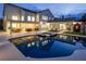 Expansive backyard featuring a pool, spa, covered patio, and lush lawn for entertainment and relaxation at 8000 Clock Tower Ct Ct, Las Vegas, NV 89117