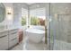 Serene bathroom featuring soaking tub, glass shower, and modern vanity at 8000 Clock Tower Ct Ct, Las Vegas, NV 89117