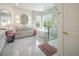 Bright bathroom with freestanding tub, glass shower, and dual vanities at 8000 Clock Tower Ct Ct, Las Vegas, NV 89117