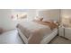 Comfortable bedroom featuring a plush bed with a textured headboard and modern nightstands at 8000 Clock Tower Ct Ct, Las Vegas, NV 89117