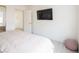 Bright bedroom featuring a comfortable bed, sleek TV, and modern décor at 8000 Clock Tower Ct Ct, Las Vegas, NV 89117