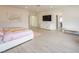 Spacious bedroom with television, seating area, and ensuite bathroom at 8000 Clock Tower Ct Ct, Las Vegas, NV 89117