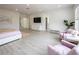 Spacious bedroom features sleek furnishings, ensuite bathroom, and sitting area at 8000 Clock Tower Ct Ct, Las Vegas, NV 89117