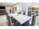 Dining room featuring an elegant dining table, modern lighting, and a view of the backyard at 8000 Clock Tower Ct Ct, Las Vegas, NV 89117
