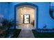 Inviting entryway with tiled floor, peacock sculpture, desert landscaping, and double doors at 8000 Clock Tower Ct Ct, Las Vegas, NV 89117