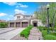A luxurious home featuring manicured landscaping, and a spacious three-car garage at 8000 Clock Tower Ct Ct, Las Vegas, NV 89117