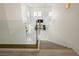 Modern home featuring a staircase with glass railing leading to a bright, open living space at 8000 Clock Tower Ct Ct, Las Vegas, NV 89117