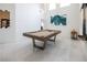 This game room has a pool table, high ceilings, and access to other rooms at 8000 Clock Tower Ct Ct, Las Vegas, NV 89117