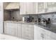 Well-appointed kitchen with sleek countertops, custom backsplash, and modern fixtures at 8000 Clock Tower Ct Ct, Las Vegas, NV 89117