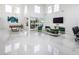 Bright living room with high ceilings, a pool table, and a wall-mounted TV at 8000 Clock Tower Ct Ct, Las Vegas, NV 89117