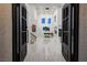 Double door entrance into the open concept living room featuring high ceilings at 8000 Clock Tower Ct Ct, Las Vegas, NV 89117