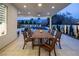 Outdoor dining area under a covered patio overlooking a pool and landscaped backyard at 8000 Clock Tower Ct Ct, Las Vegas, NV 89117