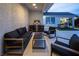 Cozy outdoor space with comfortable seating, a modern grill, and views of the backyard at 8000 Clock Tower Ct Ct, Las Vegas, NV 89117