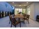 Covered outdoor patio with large table, chairs, and open views to the backyard at 8000 Clock Tower Ct Ct, Las Vegas, NV 89117
