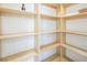 Walk-in pantry with custom shelving, providing ample storage space for all your kitchen essentials at 8000 Clock Tower Ct Ct, Las Vegas, NV 89117