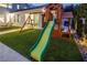 Outdoor playset with a slide, perfect for Gathering fun in the backyard on artificial grass at 8000 Clock Tower Ct Ct, Las Vegas, NV 89117