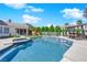 Backyard pool features a play area, lounge chairs, covered sitting, and privacy landscaping at 8000 Clock Tower Ct Ct, Las Vegas, NV 89117