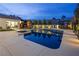 Backyard pool and spa featuring an outdoor swing and play structure, great for Gathering fun at 8000 Clock Tower Ct Ct, Las Vegas, NV 89117