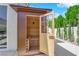 Inviting outdoor sauna with wood paneling and glass door set in lush landscaping, for relaxing in the backyard at 8000 Clock Tower Ct Ct, Las Vegas, NV 89117
