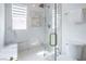 Elegant bathroom with a large glass enclosed shower with marble tile surround at 8000 Clock Tower Ct Ct, Las Vegas, NV 89117