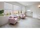 Bright sitting area with stylish furniture, a view outside from the large windows, and a wet bar at 8000 Clock Tower Ct Ct, Las Vegas, NV 89117