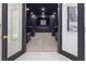 Home theater boasts a large screen, moody lighting, and comfortable seating for the ultimate viewing experience at 8000 Clock Tower Ct Ct, Las Vegas, NV 89117