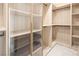 Spacious walk-in closet with lots of shelves, drawers and places to hang clothes at 8000 Clock Tower Ct Ct, Las Vegas, NV 89117