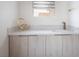 Wet bar with bright countertops and light wood cabinets at 8000 Clock Tower Ct Ct, Las Vegas, NV 89117