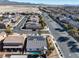 Aerial view of the neighborhood with solar panels on the home's roof and a community of homes nearby at 8811 Pauley Hills St, Las Vegas, NV 89131