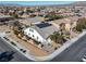 Aerial view showcases backyard, neighborhood, white exterior, solar panels, and professional landscaping at 8811 Pauley Hills St, Las Vegas, NV 89131
