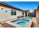 This backyard features a pool and attached hot tub, plus an outdoor storage shed at 8811 Pauley Hills St, Las Vegas, NV 89131