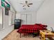 Cozy bedroom with carpet flooring, ceiling fan and a window for ample natural light at 8811 Pauley Hills St, Las Vegas, NV 89131