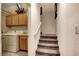 Hallway with stairs and a laundry room including a washer and dryer at 8811 Pauley Hills St, Las Vegas, NV 89131