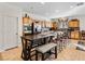Modern kitchen featuring stainless steel appliances and a large island with seating at 8811 Pauley Hills St, Las Vegas, NV 89131