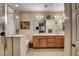 Well-lit main bath with a double sink vanity, separate shower, and tub at 8811 Pauley Hills St, Las Vegas, NV 89131