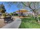 A covered playground with benches and green space offers outdoor recreation in this community at 8811 Pauley Hills St, Las Vegas, NV 89131