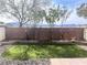 Backyard with artificial grass, rock surround and block wall for privacy at 9535 Leaping Lizard St, Las Vegas, NV 89178