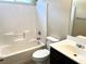 Clean bathroom featuring tub with tile surround and modern vanity at 9535 Leaping Lizard St, Las Vegas, NV 89178