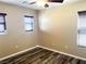 Comfortable bedroom featuring wood-look floors, horizontal blinds and neutral color scheme at 9535 Leaping Lizard St, Las Vegas, NV 89178