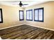 Bright bedroom featuring a ceiling fan and shuttered windows with natural light at 9535 Leaping Lizard St, Las Vegas, NV 89178