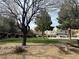 Inviting picnic area provides a relaxing outdoor space with mature trees, picnic table, and green space to enjoy at 9535 Leaping Lizard St, Las Vegas, NV 89178